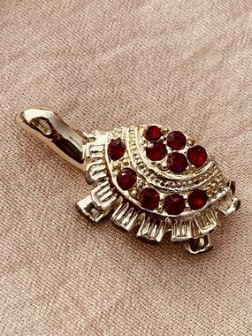 Gold-Tone Turtle Brooch with Red Crystal Accents